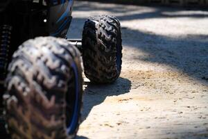 Toys Photography. Closeup Toys. Macro photo of RC Remote Control Car from the side view. There are lights, car wheels, suspension and bumpers. Shot with a macro lens