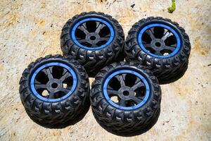 A set of toy car tires. Four pieces of RC Remote Control Car tires. Toys Photography. Hobbies and leisure. Selective Focus. Textured Details. Shot in Macro lens photo