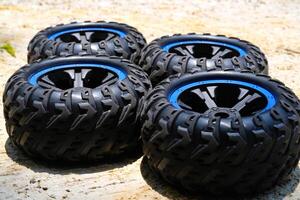 A set of toy car tires. Four pieces of RC Remote Control Car tires. Toys Photography. Hobbies and leisure. Selective Focus. Textured Details. Shot in Macro lens photo