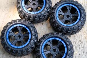 A set of toy car tires. Four pieces of RC Remote Control Car tires. Toys Photography. Hobbies and leisure. Selective Focus. Textured Details. Shot in Macro lens photo