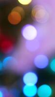 Star rain. Abstract motion background shining colorful particles. Shimmering Glittering Particles With Bokeh. New year and Christmas 2025, 2024 background. Noise. Seamless 4K loop animation video