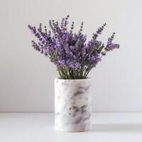 A sleek marble vase holds a bouquet of fragrant lavender flowers. photo