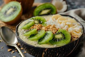 Coconut smoothie bowl topped with granola photo