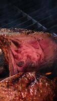 cooking steaks on the fire in real Close-up view of juicy cooked slices of meat with flames. original dish recipe. Professional cooking, food recipe, cooking. Horizontal . Top view. video