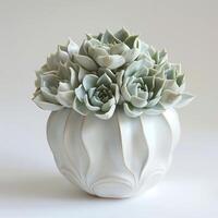 Contemporary ceramic vase showing a group of succulent sculptures. photo