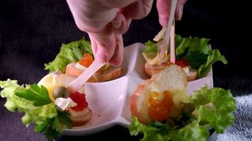 Sandwiches with red and black caviar on white and Black bread video