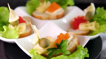 Sandwiches with red and black caviar on white and Black bread video