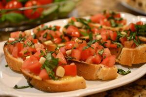 Bruschetta topped with diced tomatoes photo