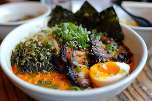 Spicy ramen with tender pork belly Soft Boiled Eggs and Nori photo