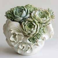 Contemporary ceramic vase showing a group of succulent sculptures. photo