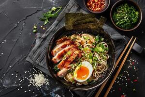 Spicy ramen with tender pork belly Soft Boiled Eggs and Nori photo