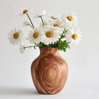 Handmade wooden vase showing a bouquet of daisies. photo