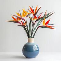 Contemporary ceramic vase shows a group of birds of paradise in bloom. photo