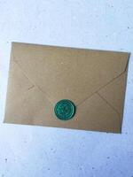 one vintage wax coin stamped on envelope on a light background photo