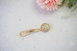 Colorful hair clips on a white background, with a flower. Top view. photo