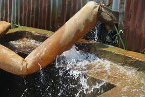 a water pump is running in a field photo