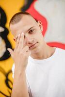 A man with a shaved head photo