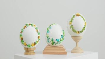 close-up of three white eggs on stands embroidery with ribbons on an eggshell example technology beautiful ornament handmade Easter holiday easter eggs decoration drawing on eggs as a gift video