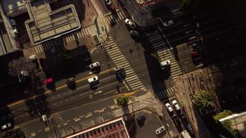 Cars traffic at crossroads. Auto road transport and crosswalk in city, top aerial view. photo