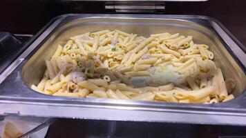 Cooked short pasta fusilli with vegerables and cheese sauce Pasta with cheese video