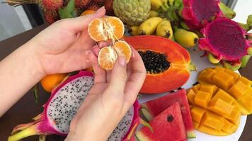 plate of fruit break tangerine slices dragon fruit mango papaya watermelon video