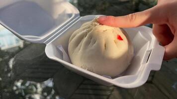 Steamed meat bun on hot steam pot, Hot steamed pork bun in bamboo steamer container. video