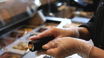 Hands preparing sushi close up. Rice and nori. video