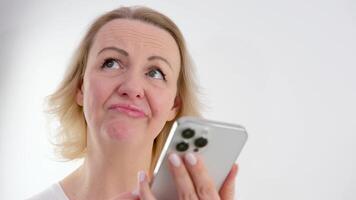 Stressed nervous young woman looking at cellphone screen, feeling frustrated of receiving message or email with bad news. Unhappy millennial female user dissatisfied with bad electronic device work. video