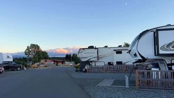 Parksville beach Surfside RV resort camping in trailers on the shores of the Pacific Ocean several trailers stand in a row next to them cars Montana trailer video