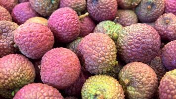 a lot of ripe juicy red lychee close up video