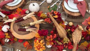 Wooden huge Table massive on which there are devices on wooden stands Mystical mysterious Halloween crows and other golden birds sit on the table Autumn bright orange and yellow flowers dry up video