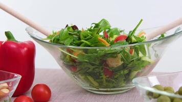 on table beige tablecloth close-up fresh cooked salad with wooden spoons on white background healthy eating concept delicious food space for text restaurant advertisement menu nude video