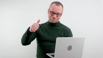 adult man in glassesold green sweater good luck success victory great project office worker the boss is satisfied with the work of subordinates well done well done great job successful purchase video