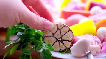 Raw meat skewers with vegetables on wooden background video