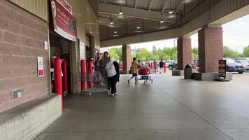 Costco Wholesale supermarket with groceries people go shopping big carts picking up goods shopping video