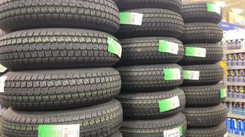 tires for wheels are on display in the middle of the store inside Princess Auto Ltd. is a Canadian retail chain specializing in farm, industrial, garage, hydraulics and surplus items. video