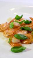 Roasted Prawns on frying pan served on white wooden cutting board video