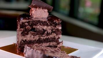 Eating chocolate dessert with golden fork. Take a slice chocolate biscuit cake video