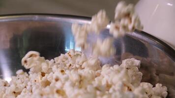 Fresh popcorn, made in an industrial popcorn machine. video