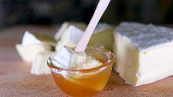 Camembert cheese round, rotation in circle. Camembert grilled cheese, Turning. selective focus. video