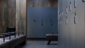 Nice school changing room interior. Men's dressing room with blue metal lockers in the college gym. American locker room gym school interior. Office wardrobe, locker room in sport club. Dressing room video