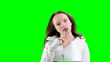 young teenage girl studying at school, lost in thought, biting her pen in wind, leafing through sheets of notebook, sitting by the window close-up in classroom on white background, one young woman video