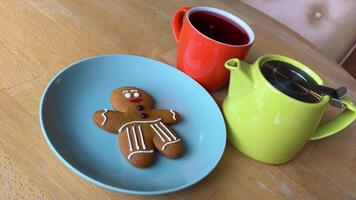 bright dishes pour red tea Hibiscus near the gingerbread man gift Christmas delicious video