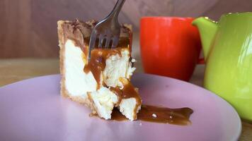 Traditional New York Cheesecake With Salted Caramel Sauce Topping On Yellow Background video