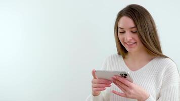 Footage of Woman Using Her Mobile Phone to Chat and Smile video