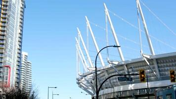 Vancouver BC place Stadium and surrounding buildings shot from moving boat in morning, Canada video