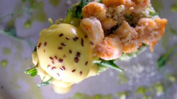 breakfast toast with avocado and egg shrimp Parmesan greens appetizing aromatic lunch snack sprinkled with flax grains seeds on gray plate restaurant serving dipping shrimp egg yolk several s video