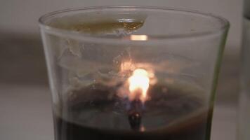 close up burning candle fire old candle soot video
