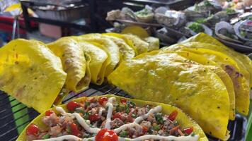 Close up cooking pizza vietnam in walking street market in Thailand on night video