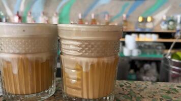 Coffee with salted caramel or egg Vietnamese coffee on a bar counter in barista restaurant video